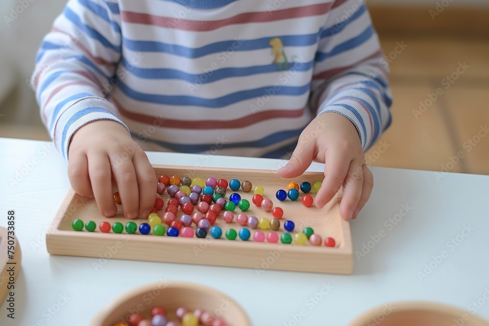 A child happily playing with a Montessori wooden bead board, exploring colors and patterns. A child happily playing with a Montessori wooden bead board, exploring colors and patterns.