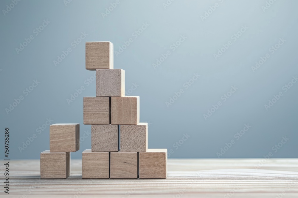 Stacked building blocks forming a tower Stacked building blocks forming a tower