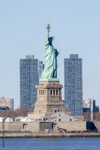 Statue of Liberty with Jersey City in the background © James