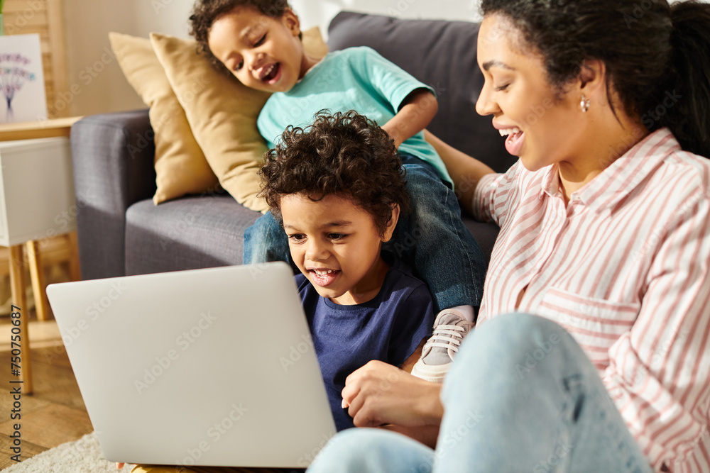 cheerful attractive african american mother watching interesting movies with her two little sons cheerful attractive african american mother watching interesting movies with her two little sons