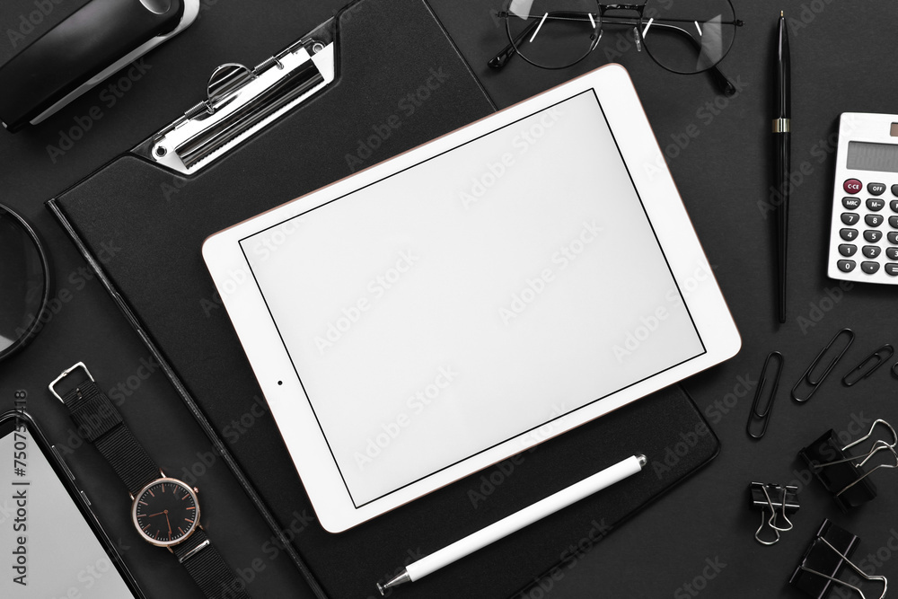 Flat lay composition with modern tablet on black background. Space for text Flat lay composition with modern tablet on black background. Space for text
