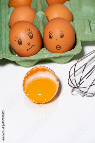 chicken eggs with painted faces, ingredients for baking, vertical