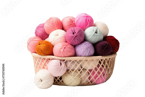 Basket Filled With Balls of Yarn. A basket filled with colorful balls of yarn neatly arranged in rows. The balls of yarn vary in size and texture, ready to be used for knitting or crocheting projects. photo