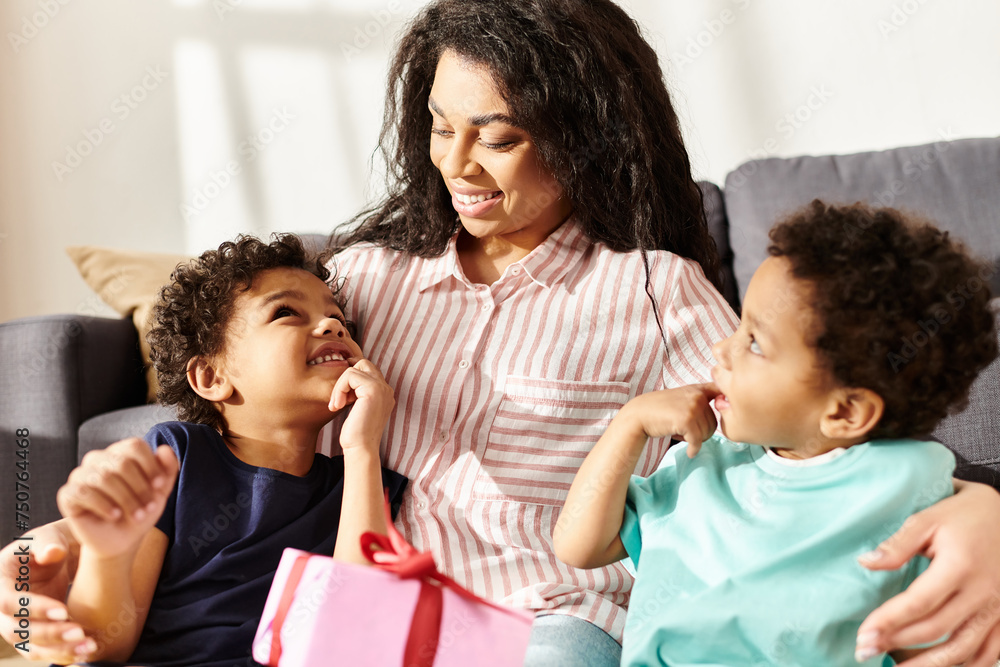 merry attractive african american mother in homewear having great time with her little kids merry attractive african american mother in homewear having great time with her little kids