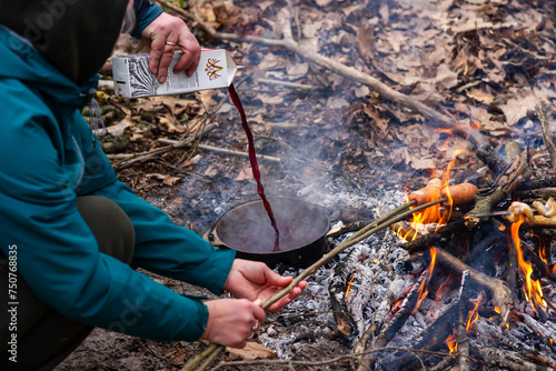 cooking on a fire in a spring forest, travelling