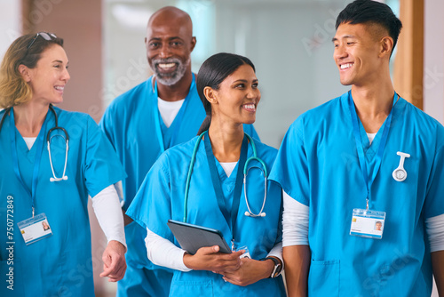 Smiling Multi Cultural Medical Team Wearing Scrubs Talking In Modern Hospital 