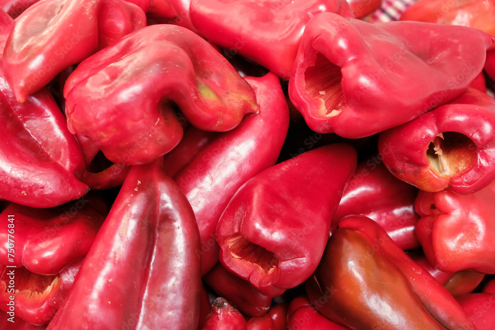 Preparing red paprika pepper for roasting for winter Preparing red paprika pepper for roasting for winter
