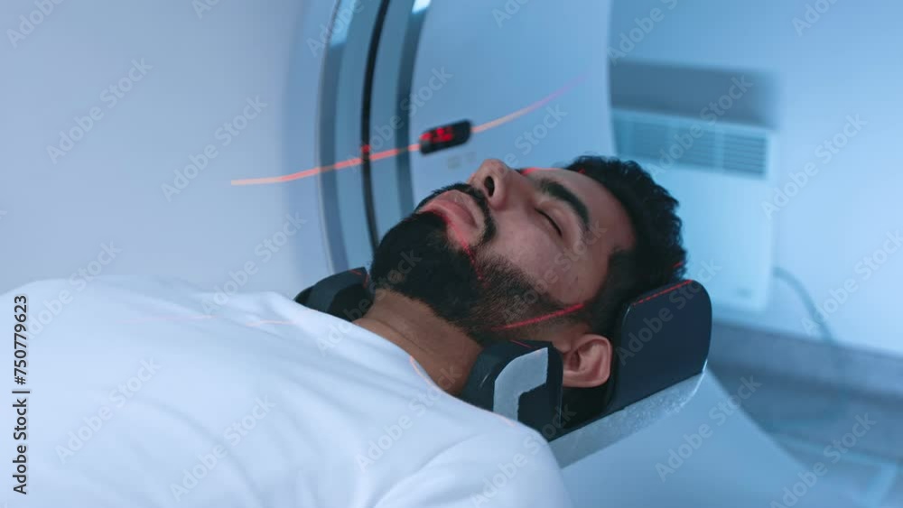 Ct Scanner Red Rays Close up of an lying on CT scanner during machine imaging body, lights ...