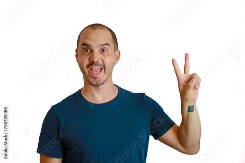 expressive bald man making hand gesture and funny face , victory symbol with fingers