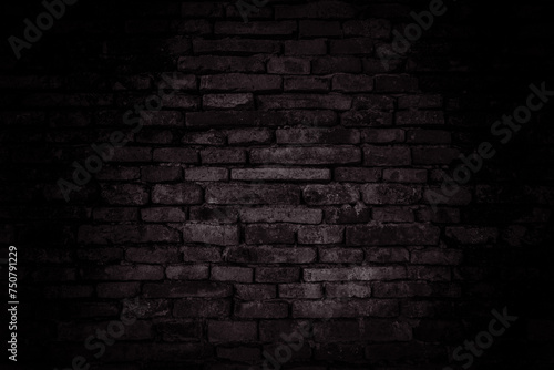 Black brick walls that are not plastered background and texture. The texture of the brick is black. Background of empty brick basement wall.