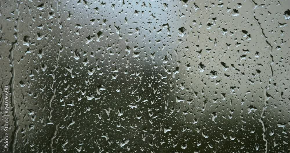 Rain dropping on glass windows Rain dropping on glass windows