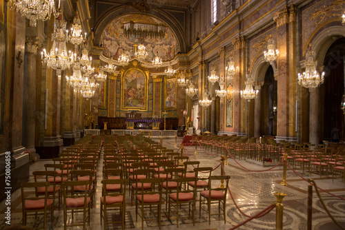 Interiors of the Basilica of Santi Giovanni e Paolo in Rome, Italy. It is a Catholic place of worship located on the Celian hill. It is nicknamed the Church of Chandeliers.