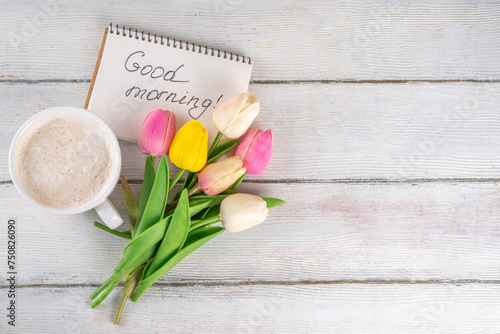 Fototapeta Naklejka Na Ścianę i Meble -  Spring morning with coffee latte cup background with Good morning note and bouquet of tulips flowers. Spring holidays, holiday background, greeting card, top view flat lay copy space