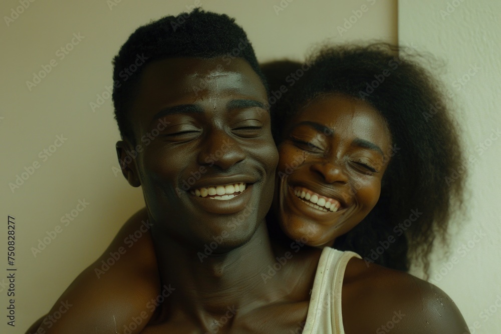 A man and a woman joyfully smile together, radiating happiness and warmth in a shared moment of love and connection A man and a woman joyfully smile together, radiating happiness and warmth in a shared moment of love and connection