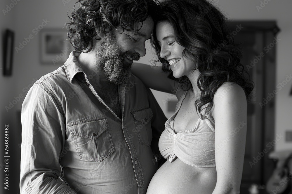 A man and a pregnant woman stand tenderly close, sharing a moment of love and support A man and a pregnant woman stand tenderly close, sharing a moment of love and support
