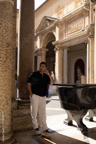 Young tourist man visits Vatican Museum.