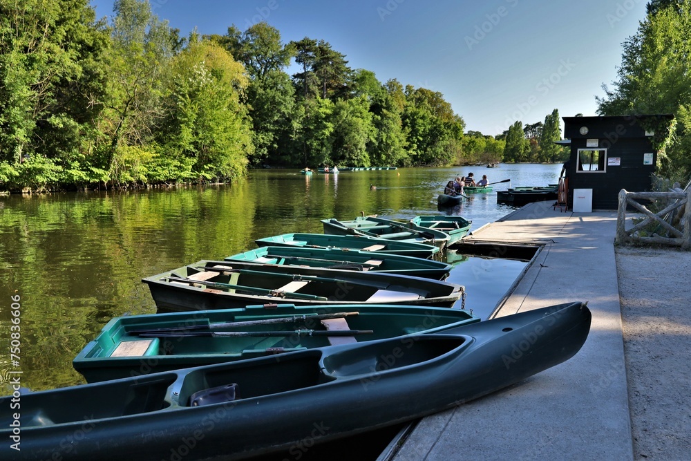 small boats on the Bois de Vincennes pond , leisure activity - obrazy, fototapety, plakaty 