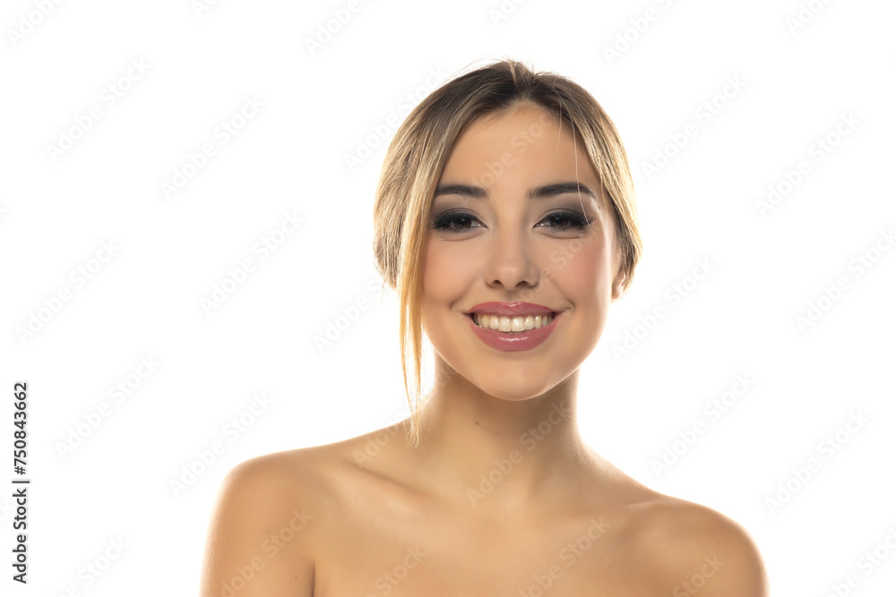 Portrait of young beautiful smiling blonde woman with makeup and tied hair on white studio background Portrait of young beautiful smiling blonde woman with makeup and tied hair on white studio background