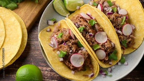 carnitas tacos with salsa and lime