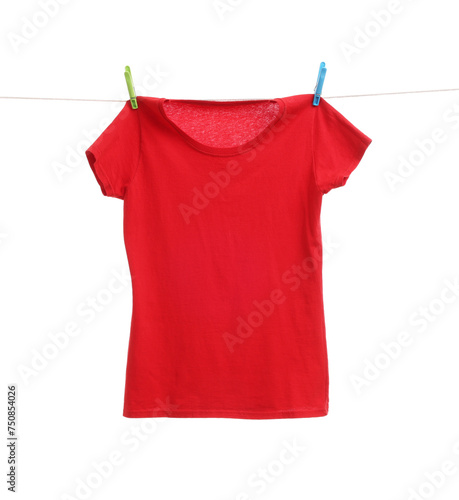 One red t-shirt drying on washing line isolated on white