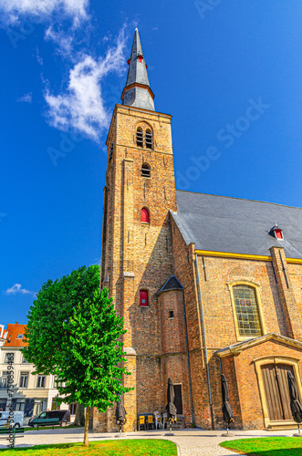 Sint-Annakerk St Anne’s Church Gothic style building on Sint-Annaplein square in Brugge city historical centre, Bruges old town Sint-Anna quarter, vertical view, West Flanders province, Belgium photo