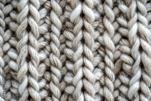 Knitted wool texture in blue beige color for background and design. Texture of a knitted item.