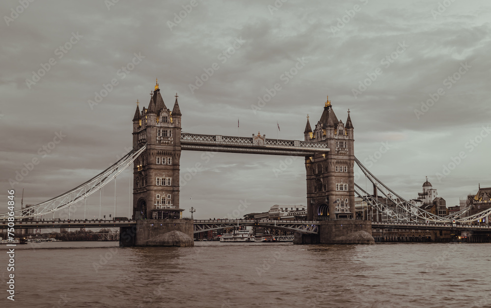 Fototapeta premium Scenery view of famous Tower bridge and skyline in the river thames at evening. Vintage style, Copy space, Selective focus.