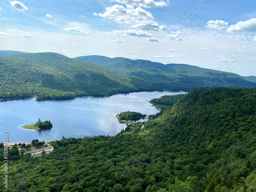 High viewpoint of a lake in the mountains. Landscape of a river at the top of a mountain. Lookout point from a forest hike. photo