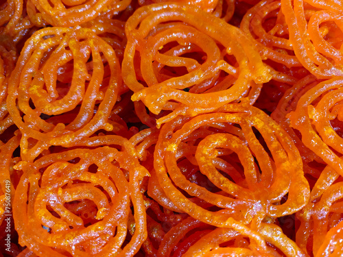 Hot Jalebi coated in sugar syrup, jalebi indian sweet.