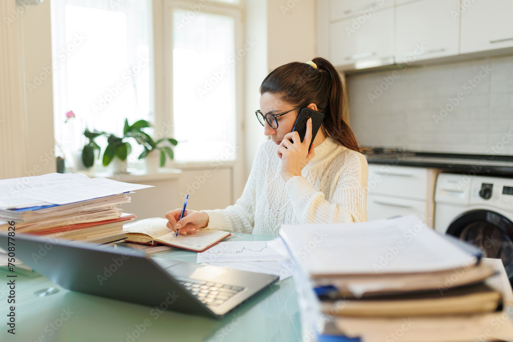 Freelance Talk Woman with Glasses Discusses Work on Phone at Home Freelance Talk Woman with Glasses Discusses Work on Phone at Home