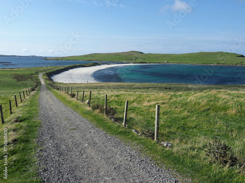 Minn beach, or Bannaminn beach, a stunning tombolo in the Shetland islands. Blue sky, turquoise water and white sand. Shetland Islands. Scotland