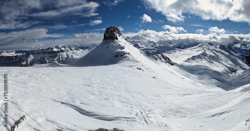 Ski tour on the Spitzmeilen and Wissmeilen in Glarnerland. Ski mountaineering in very strong winds. Skimo in winter with beautiful deep snow. Skitour Flumserberg. High quality photo. photo