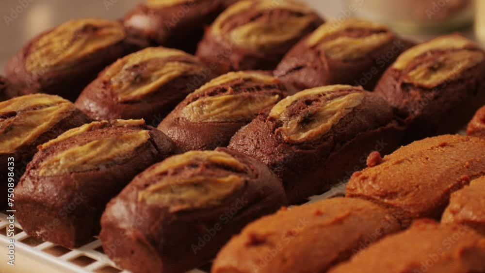 Fresh bake double chocolate banana artesian bread in bakery shop close-up. Artisan bread is making by skill bakers using natural and high-quality ingredients. Food with health and flavour Fresh bake double chocolate banana artesian bread in bakery shop close-up. Artisan bread is making by skill bakers using natural and high-quality ingredients. Food with health and flavour