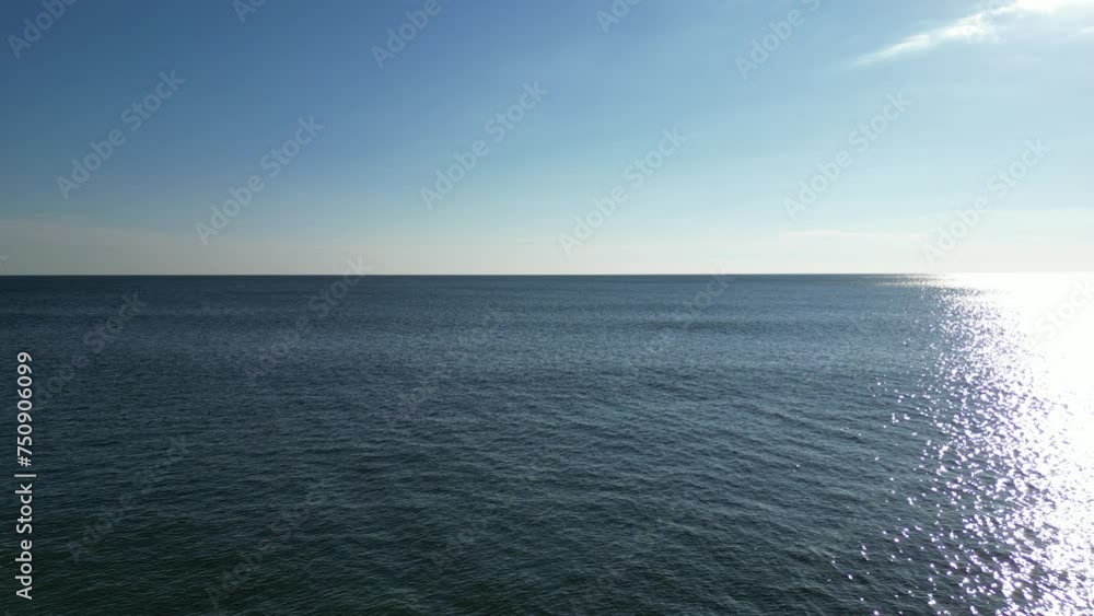 Drone flying into the sea horizon Drone flying into the sea horizon