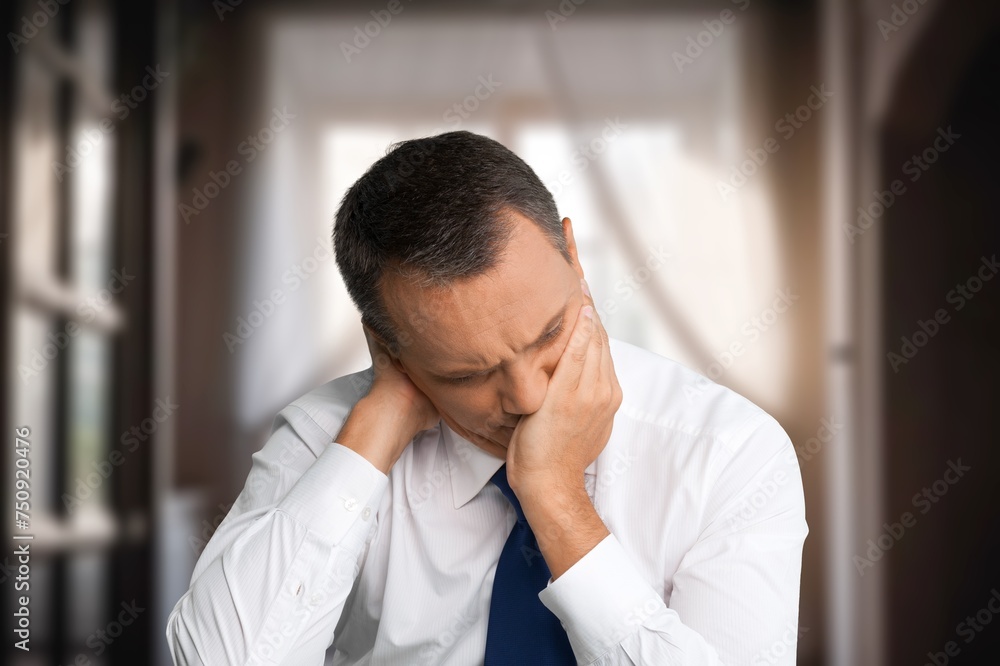 Male sad suffering from awful headache Male sad suffering from awful headache
