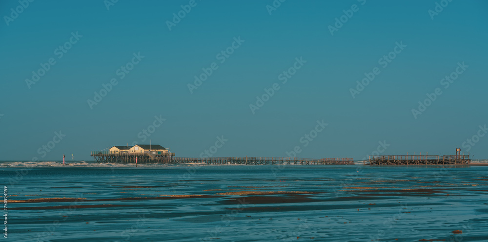 Fototapeta premium Pile dwelling on the beach of Sankt Peter-Ording in Germany.