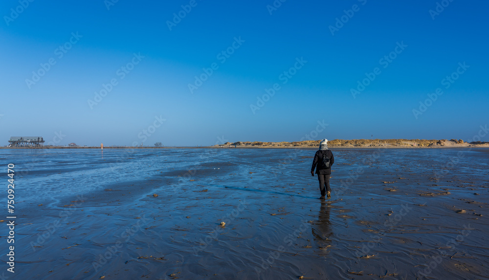 Tourists on the Norsee beach of Sankt Peter-Ording in Germany
