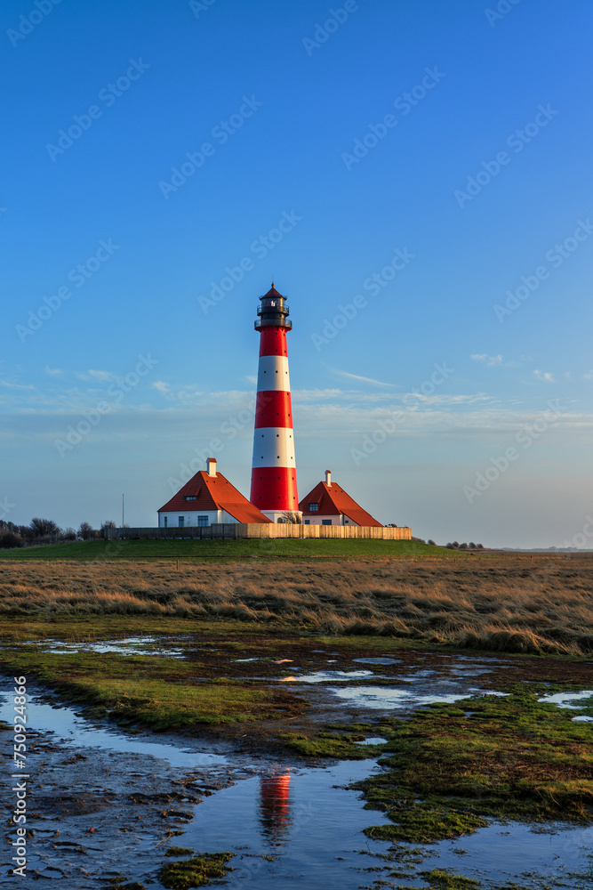 Westerheversand lighthouse on the North Sea a landmark of the Eiderstedt peninsula in Germany.