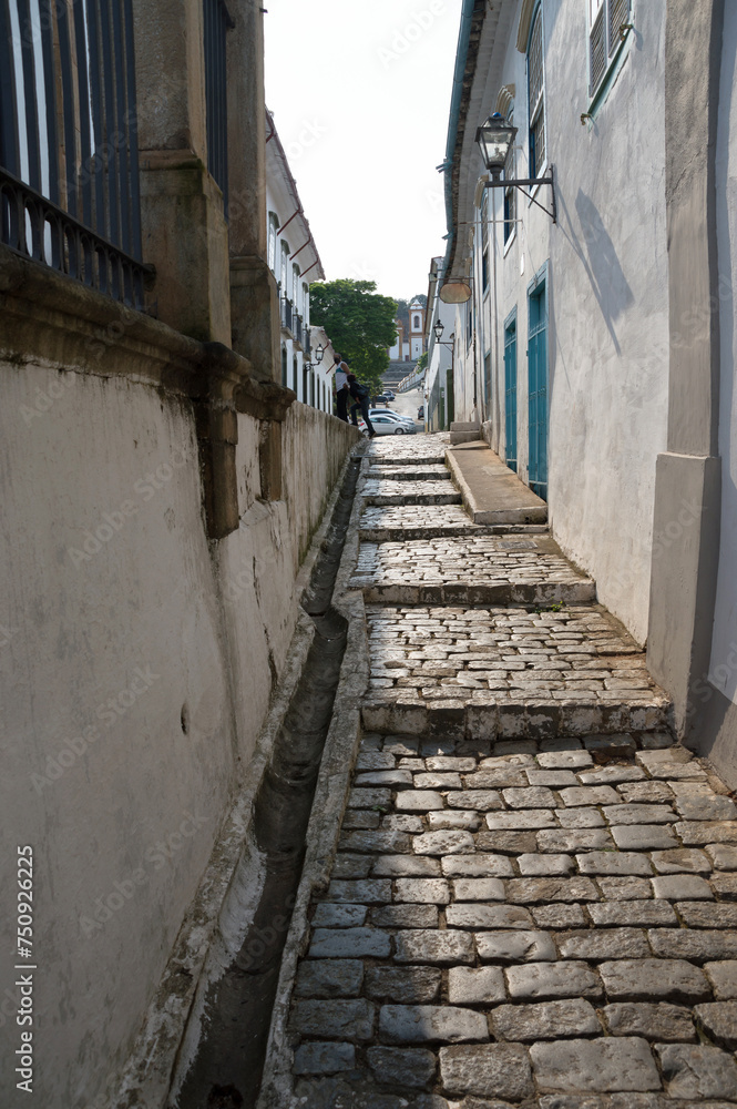 Vertical image of narrow alley paved with stones in the historic center of São João Del Rei Vertical image of narrow alley paved with stones in the historic center of São João Del Rei