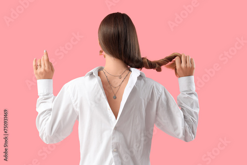 Woman with silver necklace ...