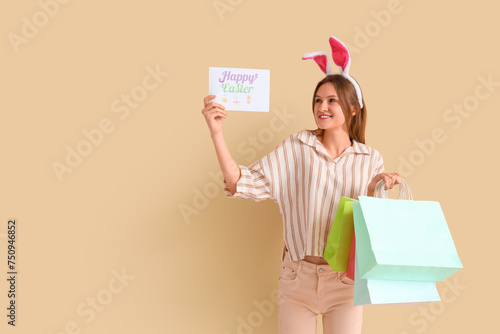 Young woman in bunny ears w...
