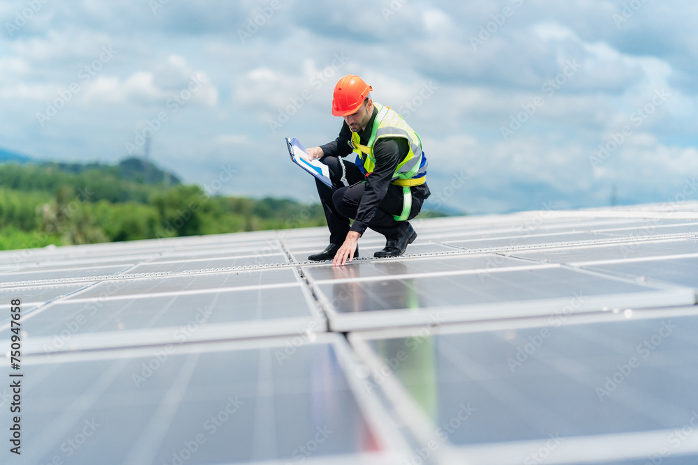 Male professional engineer installing solar photovoltaic panel system, Electrician mounting blue solar module technology on power industrial factory roof, Alternative energy ecological technician job Male professional engineer installing solar photovoltaic panel system, Electrician mounting blue solar module technology on power industrial factory roof, Alternative energy ecological technician job