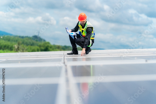 Male professional engineer installing solar photovoltaic panel system, Electrician mounting blue solar module technology on power industrial factory roof, Alternative energy ecological technician job