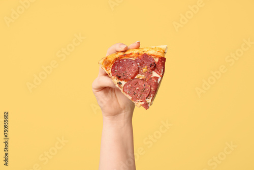 Hand holding single slice o...