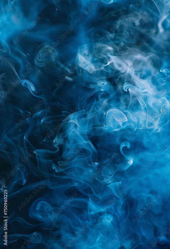 Abstract blue smoke against a dark black background, with a misty blue hue settling on the ground.