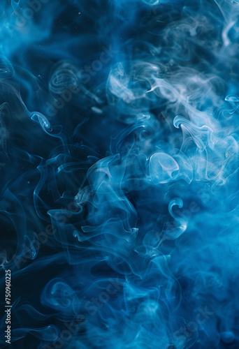 Abstract blue smoke against a dark black background, with a misty blue hue settling on the ground. © Iryna
