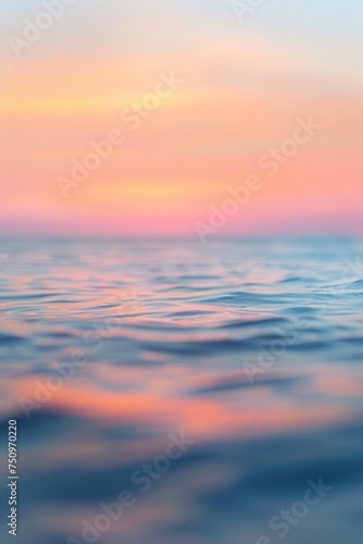 A blurry photo of the ocean at sunset. Suitable for various design projects © Fotograf