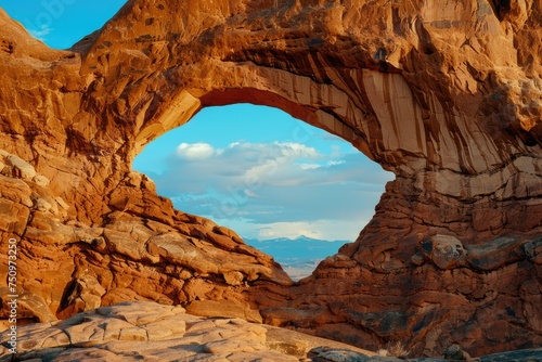 Large rock formation with a hole, suitable for various nature and landscape themes