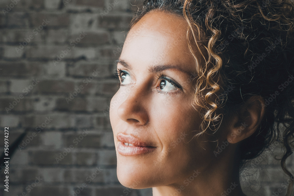 One middle age beauty woman at home thinking and looking up alone. Indoor leisure activity. Real life lifestyle people. Thoughts and dreaming young lady portrait expression. Interior person standing One middle age beauty woman at home thinking and looking up alone. Indoor leisure activity. Real life lifestyle people. Thoughts and dreaming young lady portrait expression. Interior person standing