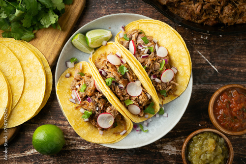 carnitas tacos with salsa and lime
